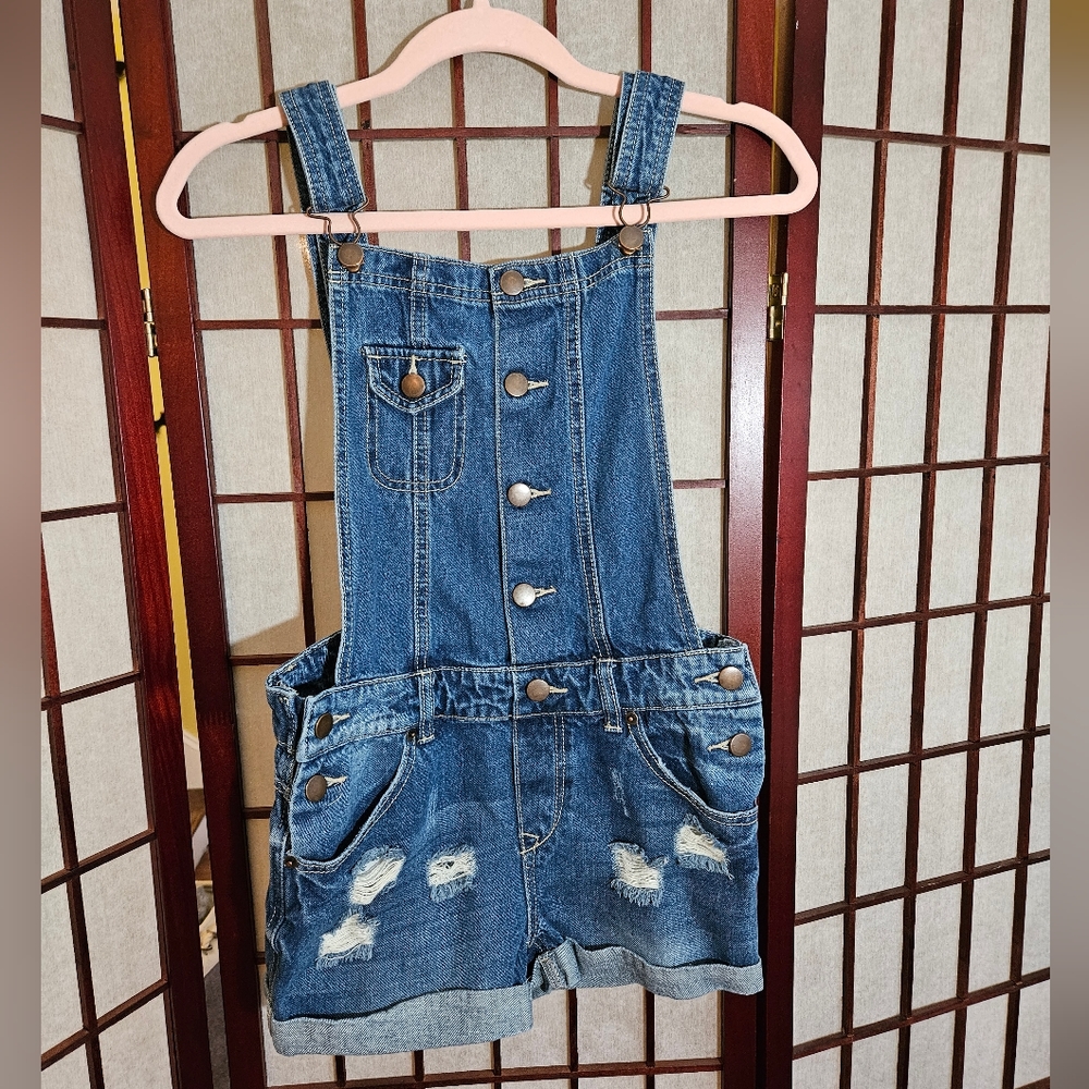 Overall shorts.